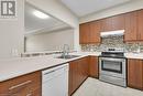 760 Woodhill Drive Unit# 219, Centre Wellington, ON  - Indoor Photo Showing Kitchen With Double Sink 