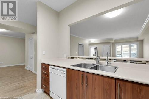 760 Woodhill Drive Unit# 219, Centre Wellington, ON - Indoor Photo Showing Kitchen With Double Sink