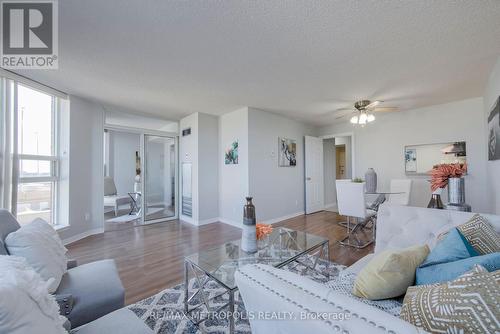 414 - 2460 Eglinton Avenue E, Toronto, ON - Indoor Photo Showing Living Room