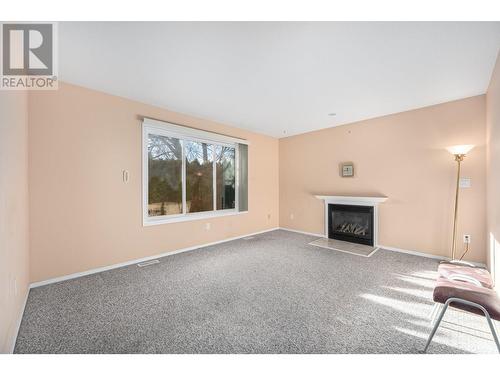 3150 Westsyde Road Unit# 2, Kamloops, BC - Indoor Photo Showing Other Room With Fireplace