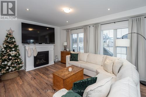 23 Mccrae Crescent, Kawartha Lakes, ON - Indoor Photo Showing Living Room With Fireplace