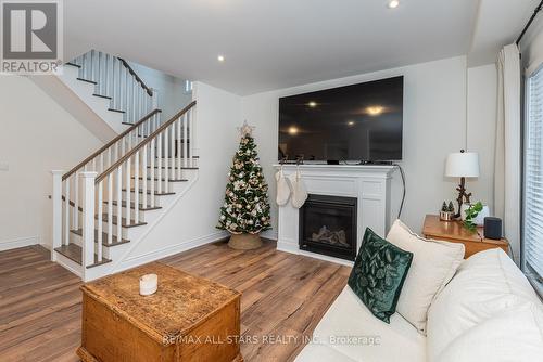 23 Mccrae Crescent, Kawartha Lakes, ON - Indoor Photo Showing Living Room With Fireplace