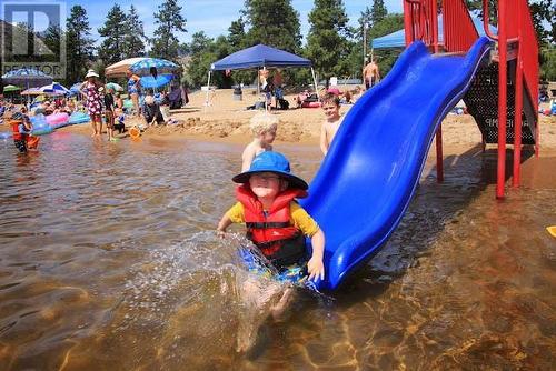 Don't you love a beach day! - 217 Elm Avenue Unit# 209, Penticton, BC - Outdoor With Body Of Water