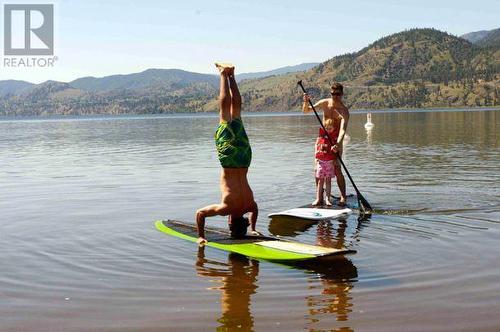 Paddleboard right outside your front door. - 217 Elm Avenue Unit# 209, Penticton, BC - Outdoor With Body Of Water With View