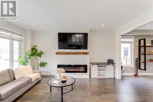 54 Hoard Avenue, New Tecumseth, ON - Indoor Photo Showing Living Room With Fireplace