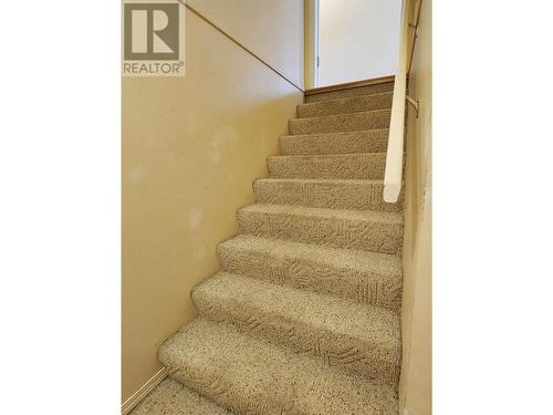 Stairwell back to the upper floor - 1038 11 Avenue Unit# 19, Vernon, BC - Indoor Photo Showing Other Room