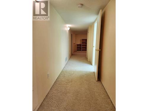 Hallway downstairs towards family room - 1038 11 Avenue Unit# 19, Vernon, BC - Indoor Photo Showing Other Room