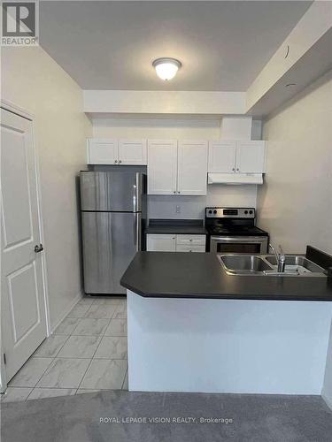 419 - 80 Aspen Springs Drive, Clarington, ON - Indoor Photo Showing Kitchen With Double Sink