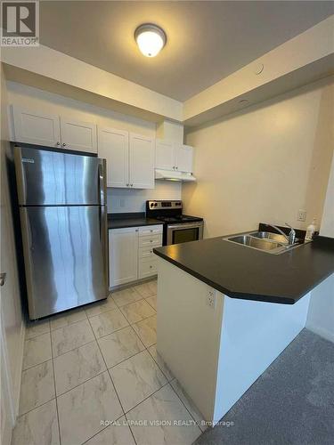 419 - 80 Aspen Springs Drive, Clarington, ON - Indoor Photo Showing Kitchen With Double Sink