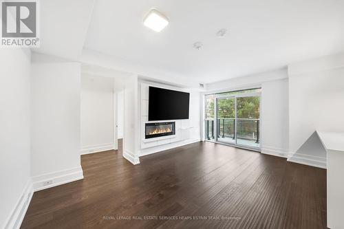 305 - 3 Southvale Drive, Toronto, ON - Indoor Photo Showing Living Room With Fireplace