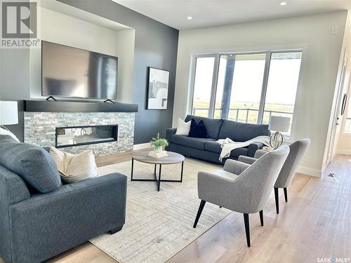 3744 Gee Crescent, Regina, SK - Indoor Photo Showing Living Room With Fireplace