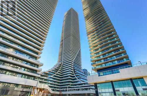 709 - 30 Shore Breeze Drive, Toronto, ON - Outdoor With Balcony With Facade