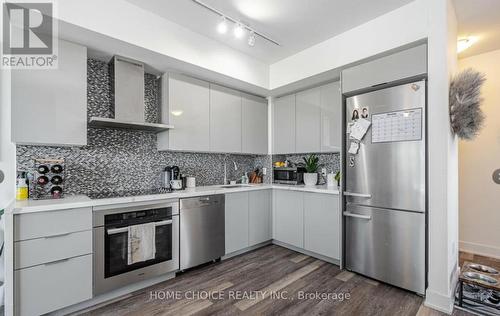 709 - 30 Shore Breeze Drive, Toronto, ON - Indoor Photo Showing Kitchen With Upgraded Kitchen