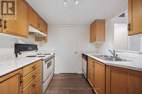 114 - 95 Wellington Street, Clarington (Bowmanville), ON - Indoor Photo Showing Kitchen With Double Sink