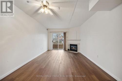 114 - 95 Wellington Street, Clarington (Bowmanville), ON - Indoor Photo Showing Other Room With Fireplace