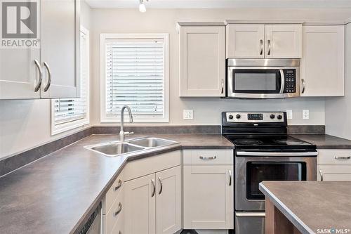 103 Denham Crescent, Saskatoon, SK - Indoor Photo Showing Kitchen With Double Sink