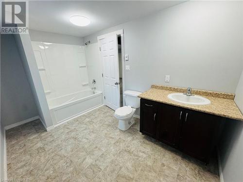 Full bathroom featuring vanity, washtub / shower combination, and toilet - 472 First Ave W, North Bay, ON - Indoor Photo Showing Bathroom