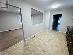 Empty room with light wood-type flooring - 