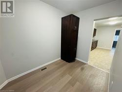 Empty room with light wood-type flooring - 