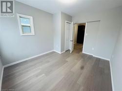 Spare room featuring light wood-type flooring - 