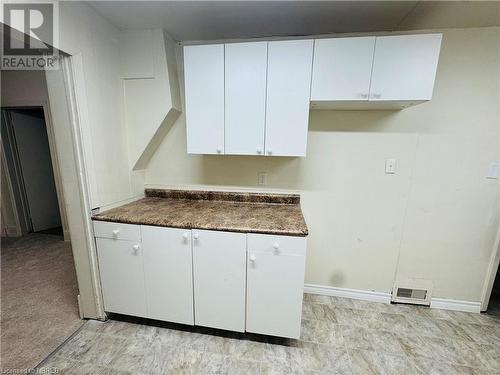 Kitchen featuring white cabinets - 472 First Ave W, North Bay, ON - Indoor