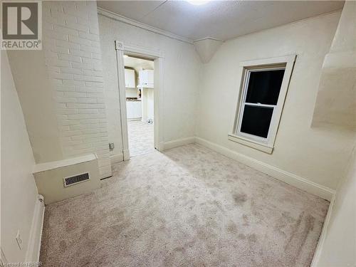 Unfurnished room featuring light colored carpet and a textured ceiling - 472 First Ave W, North Bay, ON - Indoor Photo Showing Other Room