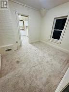 Spare room featuring carpet floors and ornamental molding - 