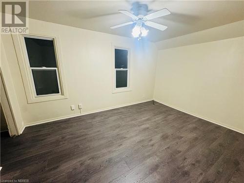 Spare room with dark hardwood / wood-style flooring and ceiling fan - 472 First Ave W, North Bay, ON - Indoor Photo Showing Other Room