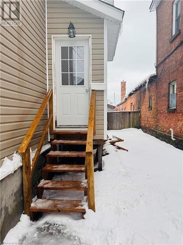 View of snow covered property entrance - 472 First Ave W, North Bay, ON - Outdoor With Exterior