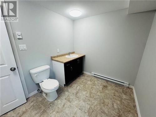 Bathroom featuring vanity, toilet, and baseboard heating - 472 First Ave W, North Bay, ON - Indoor Photo Showing Bathroom