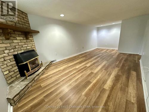 Lower - 139 Britannia Avenue, London, ON - Indoor Photo Showing Other Room With Fireplace