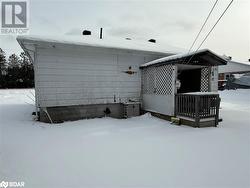 View of snow covered property - 