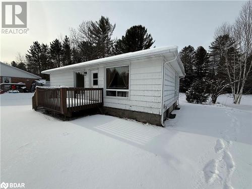 View of front of house featuring a wooden deck - 32299 Highway 17 E, Deep River, ON - Outdoor With Exterior