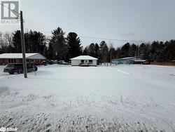 View of yard covered in snow - 