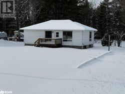 View of front of property with a deck - 