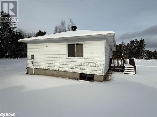 Snow covered property featuring a deck - 32299 Highway 17 E, Deep River, ON - Outdoor