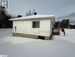 Snow covered property featuring a deck - 