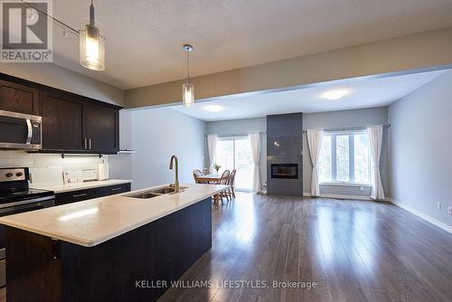 83 - 1924 Cedarhollow Boulevard, London, ON - Indoor Photo Showing Kitchen With Fireplace With Double Sink