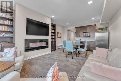 112 - 740 Augusta Drive, Kingston (City Northwest), ON - Indoor Photo Showing Living Room With Fireplace