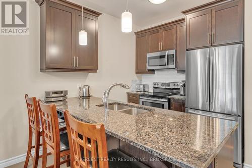 112 - 740 Augusta Drive, Kingston (City Northwest), ON - Indoor Photo Showing Kitchen With Stainless Steel Kitchen With Double Sink With Upgraded Kitchen