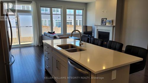 699 Taliesin Crescent, Ottawa, ON - Indoor Photo Showing Kitchen With Fireplace With Double Sink