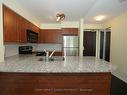 509-30 Grand Trunk Crescent, Toronto, ON  - Indoor Photo Showing Kitchen With Double Sink 