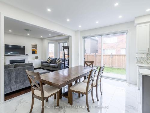 10 Schoolbridge St, Ajax, ON - Indoor Photo Showing Dining Room With Fireplace