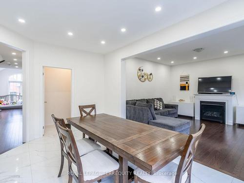 10 Schoolbridge St, Ajax, ON - Indoor Photo Showing Dining Room With Fireplace