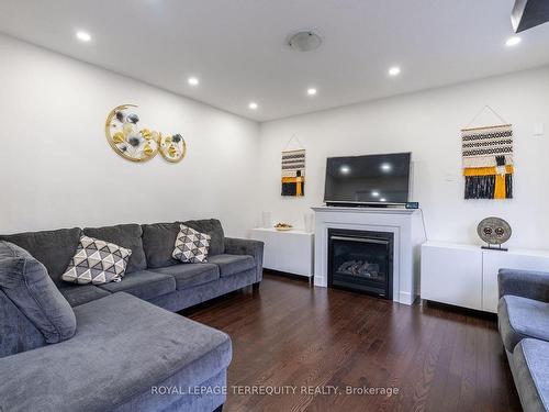 10 Schoolbridge St, Ajax, ON - Indoor Photo Showing Living Room With Fireplace