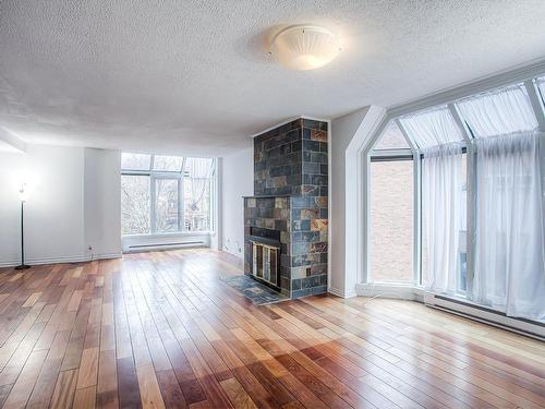 Salon - 155 Rue Terry-Fox, Montréal (Verdun/Île-Des-Soeurs), QC - Indoor Photo Showing Living Room With Fireplace