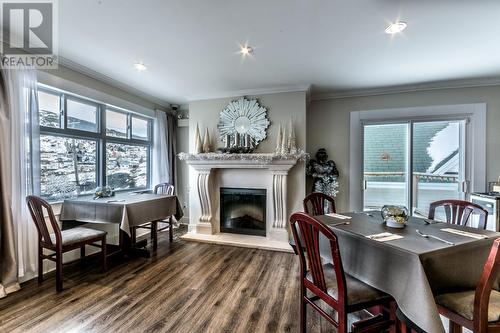 9-11 Beachy Cove Road, Portugal Cove, NL - Indoor Photo Showing Dining Room With Fireplace