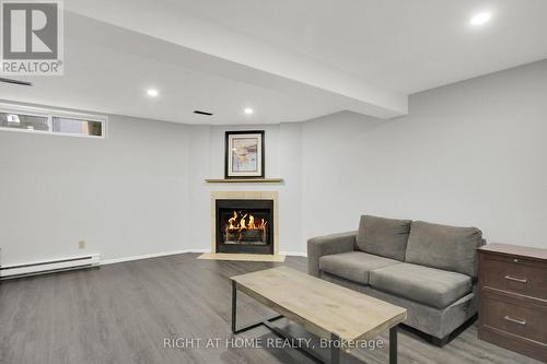 15 Bentbrook Crescent, Ottawa, ON - Indoor Photo Showing Basement With Fireplace