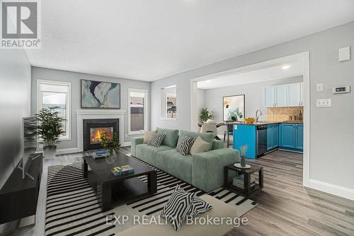 2651 Baynes Sound Way, Ottawa, ON - Indoor Photo Showing Living Room With Fireplace