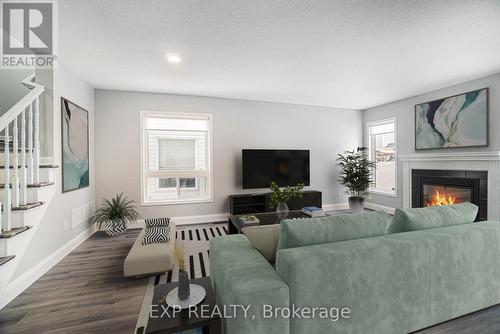 2651 Baynes Sound Way, Ottawa, ON - Indoor Photo Showing Living Room With Fireplace